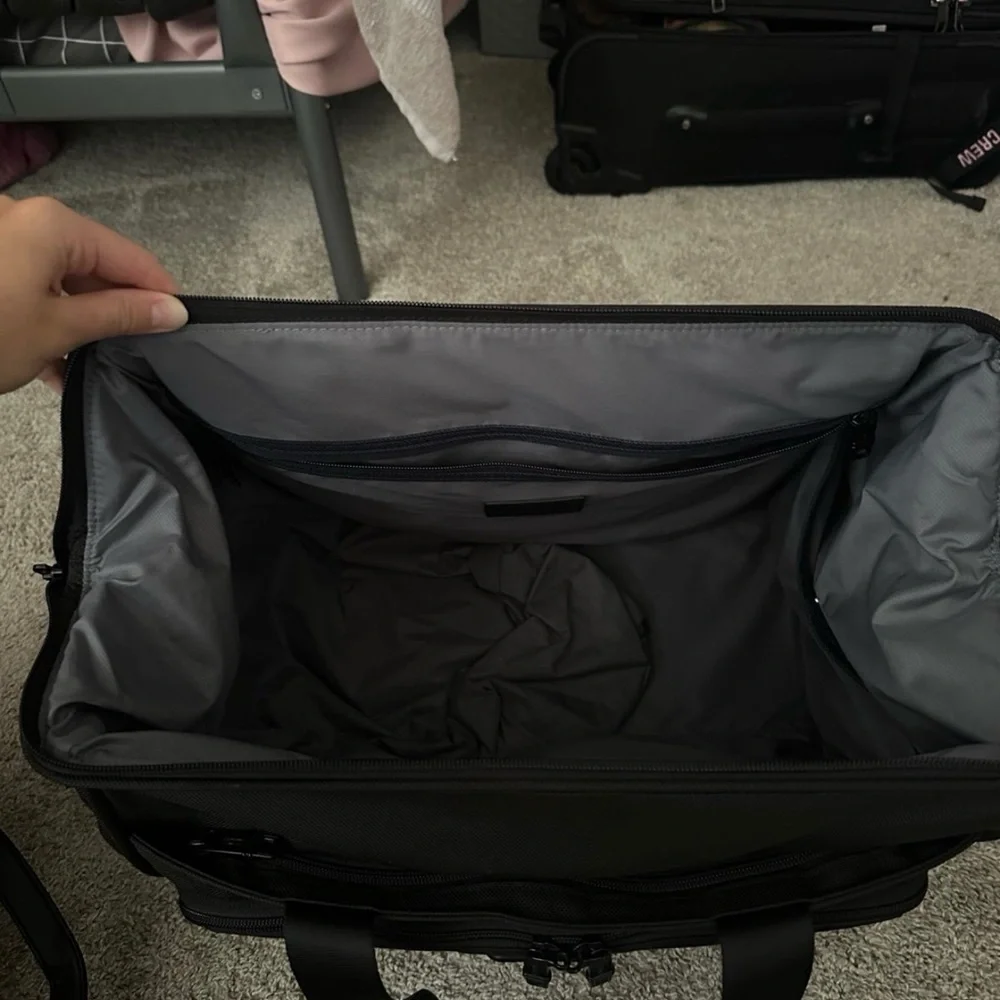 Tumi carry-on bag.